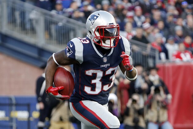 New England Patriots running back Dion Lewis runs against the Jacksonville Jaguars during the AFC Championship NFL football game at Gillette Stadium in Foxborough, Mass. Sunday, Jan. 21, 2018. (AP Photo/Winslow Townson)