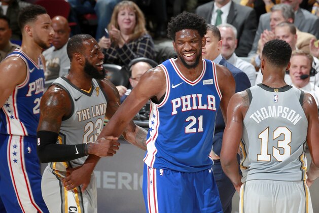 CLEVELAND, OH - MARCH 1: LeBron James #23 of the Cleveland Cavaliers and Joel Embiid #21 of the Philadelphia 76ers during the game on March 1, 2018 at Quicken Loans Arena in Cleveland, Ohio. NOTE TO USER: User expressly acknowledges and agrees that, by downloading and/or using this photograph, user is consenting to the terms and conditions of the Getty Images License Agreement. Mandatory Copyright Notice: Copyright 2018 NBAE (Photo by Jeff Haynes/NBAE via Getty Images)