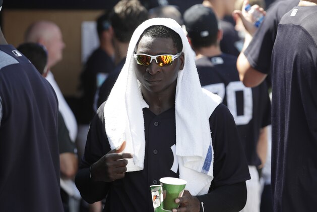 New York Yankees shortstop Didi Gregorius walks in the dugout during a baseball spring exhibition game against the Detroit Tigers, Wednesday, Feb. 28, 2018, in Tampa, Fla. (AP Photo/Lynne Sladky)