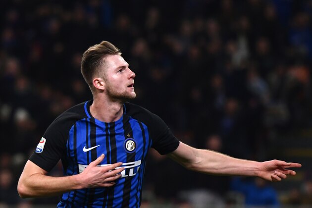 Inter Milan's defender Milan Skriniar from Slovenia celebrates after scoring during the Italian Serie A football match Inter Milan Vs Benevento on February 24, 2018 at the San Siro stadium in Milan. / AFP PHOTO / MARCO BERTORELLO        (Photo credit should read MARCO BERTORELLO/AFP/Getty Images)