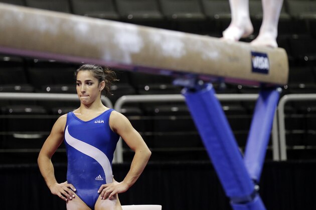 Aly Raisman waits to train on the balance beam during practice for the U.S. Olympic gymnastics trials, Wednesday, June 27, 2012, in San Jose, Calif. (AP Photo/Gregory Bull)