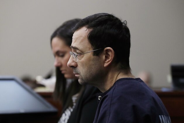 Dr. Larry Nassar is seated during the seventh day of his sentencing hearing Wednesday, Jan. 24, 2018, in Lansing, Mich. Nassar has admitted sexually assaulting athletes when he was employed by Michigan State University and USA Gymnastics, which is the sport's national governing organization and trains Olympians. (AP Photo/Carlos Osorio)