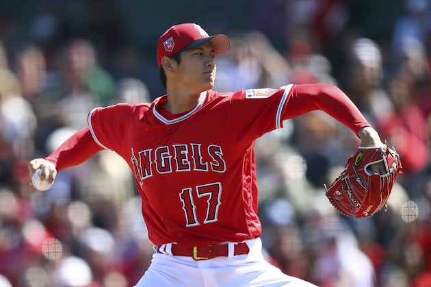 Los Angeles Angels' Shohei Ohtani works against the Milwaukee Brewers during the first inning of a spring training baseball game on Saturday, Feb. 24, 2018, in Tempe, Ariz. (AP Photo/Ben Margot)