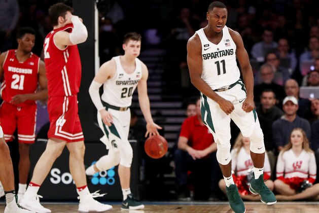 NEW YORK, NY - MARCH 02:  Lourawls Nairn Jr. #11 of the Michigan State Spartans celebrates the win at the buzzer as Ethan Happ #22 of the Wisconsin Badgers reacts during quarterfinals of the Big Ten Basketball Tournament at Madison Square Garden on March 2, 2018 in New York City.  (Photo by Elsa/Getty Images)