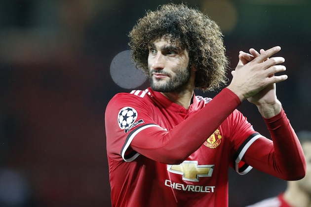 Manchester United's Marouane Fellaini greets the audience at the end of the Champions League group A soccer match between Manchester United and Basel, at the Old Trafford stadium in Manchester, Tuesday, Sept. 12, 2017. (AP Photo/Frank Augstein)