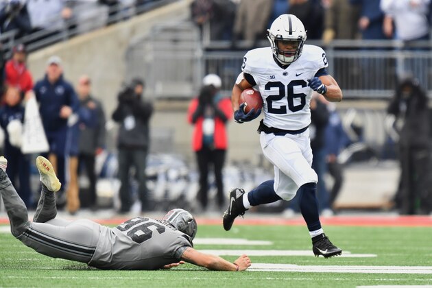 COLUMBUS, OH - OCTOBER 28:  Saquon Barkley #26 of the Penn State Nittany Lions leaps over kicker Sean Nuernberger #96 of the Ohio State Buckeyes en route to a 97-yard opening kick off return for a touchdown in the first quarter at Ohio Stadium on October 28, 2017 in Columbus, Ohio.  (Photo by Jamie Sabau/Getty Images)