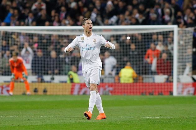 MADRID, SPAIN - FEBRUARY 14: Cristiano Ronaldo of Real Madrid celebrates after scoring his team's first goal during the UEFA Champions League Round of 16 First Leg match between Real Madrid and Paris Saint-Germain at Bernabeu on February 14, 2018 in Madrid, Spain. (Photo by TF-Images/ Getty Images)