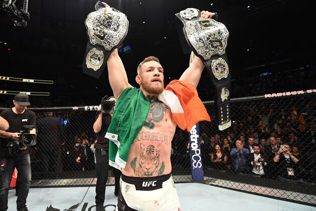 NEW YORK, NY - NOVEMBER 12:  UFC lightweight and featherweight champion Conor McGregor of Ireland celebrates after defeating Eddie Alvarez in their UFC lightweight championship fight during the UFC 205 event at Madison Square Garden on November 12, 2016 in New York City. (Photo by Jeff Bottari/Zuffa LLC/Zuffa LLC via Getty Images)