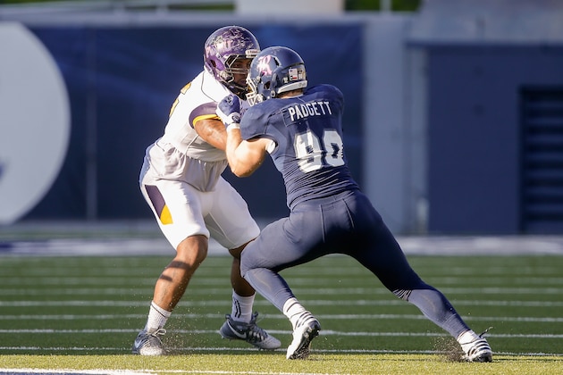 HOUSTON, TX - OCTOBER 22:Blain Padgett #90 of the Rice Owls and Josiah Freeman #56 of the Prairie View Am Panthers lock up at Rice Stadium on October 22, 2016 in Houston, Texas.  (Photo by Bob Levey/Getty Images)