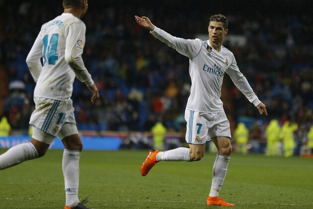 Real Madrid's Cristiano Ronaldo celebrates after scoring his side's second goal against Getafe during the Spanish La Liga soccer match between Real Madrid and Getafe at the Santiago Bernabeu stadium in Madrid, Saturday, March 3, 2018. (AP Photo/Francisco Seco)