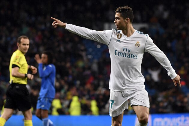 Real Madrid's Portuguese forward Cristiano Ronaldo celebrates a goal during the Spanish league football match Real Madrid CF against Getafe CF at the Santiago Bernabeu stadium in Madrid on March 3, 2018. / AFP PHOTO / PIERRE-PHILIPPE MARCOU        (Photo credit should read PIERRE-PHILIPPE MARCOU/AFP/Getty Images)
