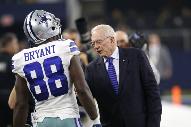 Dallas Cowboys' Dez Bryant talks with team owner Jerry Jones on the field before a half time Ring Of Honor presentation during an NFL football game against the Seattle Seahawks on  Sunday, Nov. 1, 2015, in Arlington, Texas. (AP Photo/Roger Steinman)