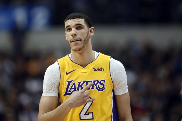 Los Angeles Lakers guard Lonzo Ball (2) signals to a teammate during an offensive possession against the Dallas Mavericks in the first half of an NBA basketball game, Saturday, Jan. 13, 2018, in Dallas. (AP Photo/Tony Gutierrez)