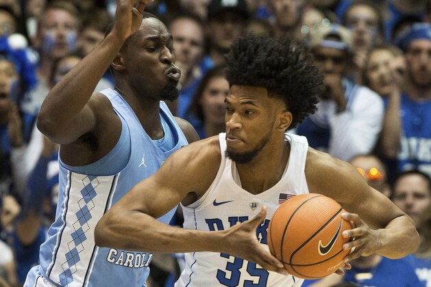 Duke's Marvin Bagley III (35) works against North Carolina's Theo Pinson during the second half of an NCAA college basketball game in Durham, N.C., Saturday, March 3, 2018. Duke defeated North Carolina 74-64. (AP Photo/Ben McKeown)