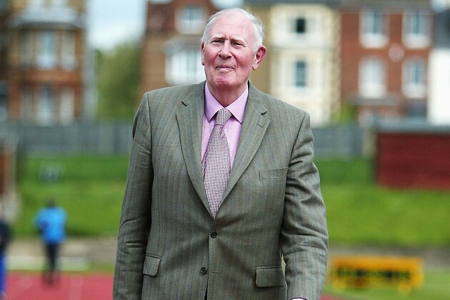 OXFORD, ENGLAND - MAY 6:  Sir Roger Bannister walks over the finish line of the Iffley Road running track to celebrate the 50th Anniversary of his first sub 4 minute mile on May 6, 2004 at Iffley Road, Oxford, England. (Photo by Jamie McDonald/Getty Images)
