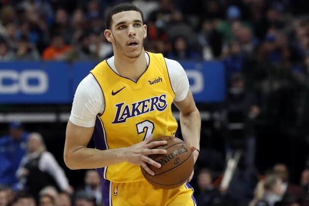 Los Angeles Lakers guard Lonzo Ball (2) handles the ball in the first half of an NBA basketball game against the Dallas Mavericks on Saturday, Jan. 13, 2018, in Dallas. (AP Photo/Tony Gutierrez)