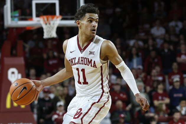 Oklahoma guard Trae Young (11) in the second half of an NCAA college basketball game against Texas in Norman, Okla., Saturday, Feb. 17, 2018. (AP Photo/Sue Ogrocki)