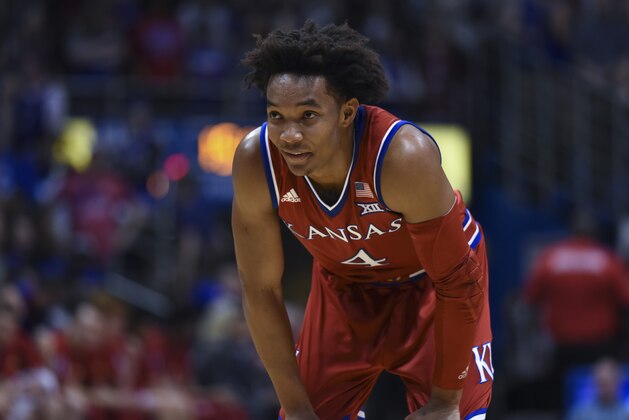 LAWRENCE, KS - FEBRUARY 26: Devonte' Graham #4 of the Kansas in action against the Texas Longhorns  at Allen Fieldhouse on February 26,  2018 in Lawrence, Kansas. (Photo by Ed Zurga/Getty Images)