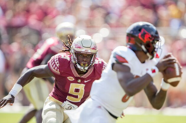 TALLAHASSEE, FL - OCTOBER 21: Defensive end Josh Sweat #9 of the Florida State Seminoles looks to sack quarterback Lamar Jackson #8 of the Louisville Cardinals at Doak Campbell Stadium on October 21, 2017 in Tallahassee, Florida. (Photo by Michael Chang/Getty Images)
