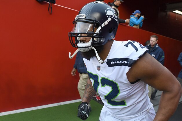 SANTA CLARA, CA - NOVEMBER 26:  Michael Bennett #72 of the Seattle Seahawks runs onto the field prior to the start of an NFL football game against the San Francisco 49ers at Levi's Stadium on November 26, 2017 in Santa Clara, California.  (Photo by Thearon W. Henderson/Getty Images)