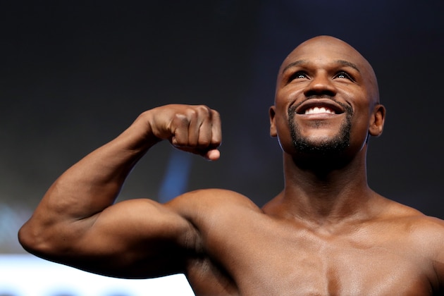 LAS VEGAS, NV - AUGUST 25:  Boxer Floyd Mayweather Jr. poses on the scale during his official weigh-in at T-Mobile Arena on August 25, 2017 in Las Vegas, Nevada. Mayweather will meet UFC lightweight champion Conor McGregor in a super welterweight boxing match at T-Mobile Arena on August 26.  (Photo by Christian Petersen/Getty Images)