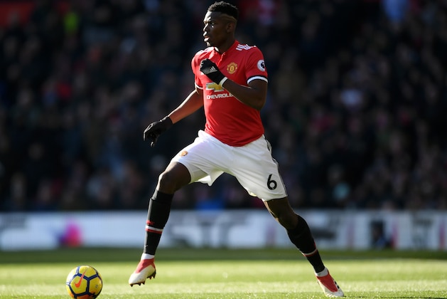 MANCHESTER, ENGLAND - FEBRUARY 25:  Paul Pogba of Manchester United runs with the ball during the Premier League match between Manchester United and Chelsea at Old Trafford on February 25, 2018 in Manchester, England.  (Photo by Laurence Griffiths/Getty Images)