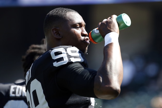 Oakland Raiders defensive end Aldon Smith (99) drinks Gatorade during an NFL football game against the Baltimore Ravens Sunday, Sept. 20, 2015, in Oakland , Calif. (AP Photo/Tony Avelar)