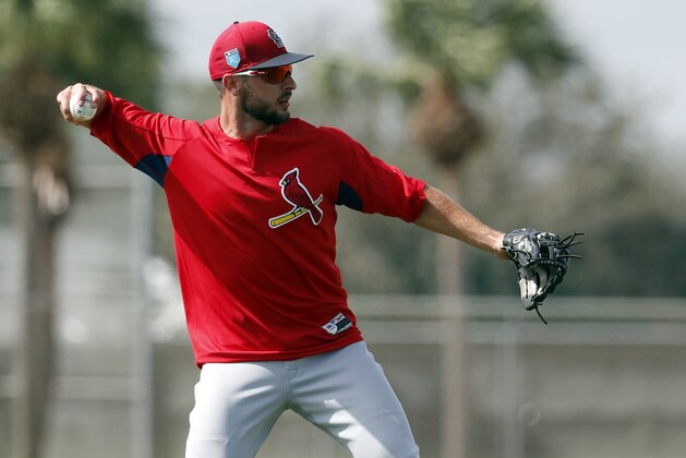 St. Louis Cardinals infielder Paul DeJong throws to first during spring training baseball practice Tuesday, Feb. 20, 2018, in Jupiter, Fla. (AP Photo/Jeff Roberson)