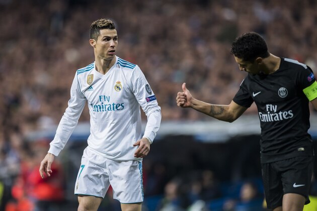 MADRID, SPAIN - FEBRUARY 14: Cristiano Ronaldo (L) of Real Madrid reacts as Marcos Aoas Correa, Marquinhos (L), of Paris Saint Germain gives a thumb-up during the UEFA Champions League 2017-18 Round of 16 (1st leg) match between Real Madrid vs Paris Saint Germain at Estadio Santiago Bernabeu on February 14 2018 in Madrid, Spain. (Photo by Power Sport Images/Getty Images)
