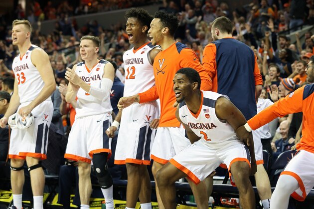 CHARLOTTESVILLE, VA - MARCH 3: Justice Bartley #2 of the Virginia Cavaliers and the rest of the bench cheers in the second half during a game against the Notre Dame Fighting Irish at John Paul Jones Arena on March 3, 2018 in Charlottesville, Virginia. Virginia defeated Notre Dame 62-57. (Photo by Ryan M. Kelly/Getty Images)