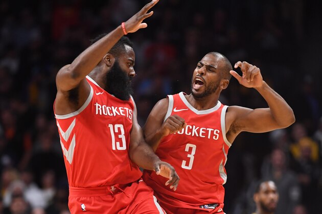 DENVER, CO - FEBRUARY 25: James Harden #13 and Chris Paul #3 of the Houston Rockets celebrate during a timeout against the Denver Nuggets at Pepsi Center on February 25, 2018 in Denver, Colorado. NOTE TO USER: User expressly acknowledges and agrees that, by downloading and or using this photograph, User is consenting to the terms and conditions of the Getty Images License Agreement. (Photo by Justin Tafoya/Getty Images)