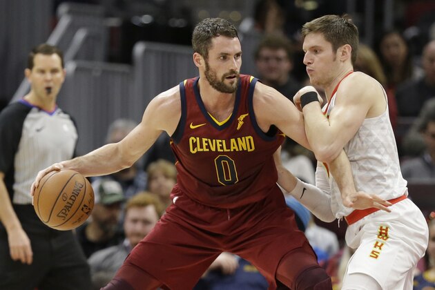 Cleveland Cavaliers' Kevin Love (0) drives against Atlanta Hawks' Luke Babbitt (8) in the first half of an NBA basketball game, Tuesday, Dec. 12, 2017, in Cleveland. (AP Photo/Tony Dejak)