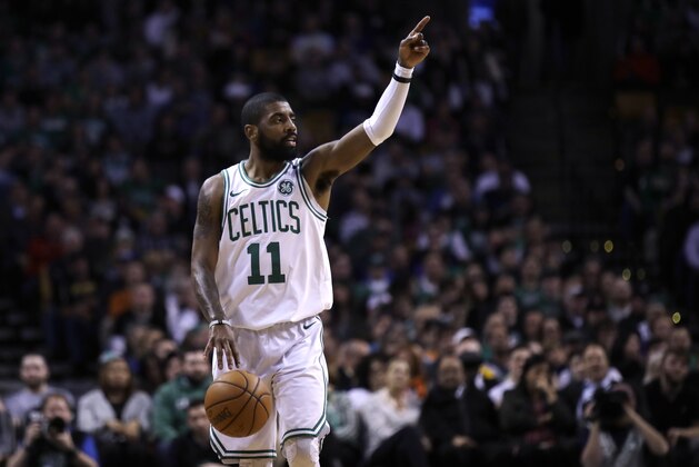 Boston Celtics guard Kyrie Irving (11) calls to teammates during the first quarter of an NBA basketball game in Boston, Wednesday, Feb. 28, 2018. (AP Photo/Charles Krupa)