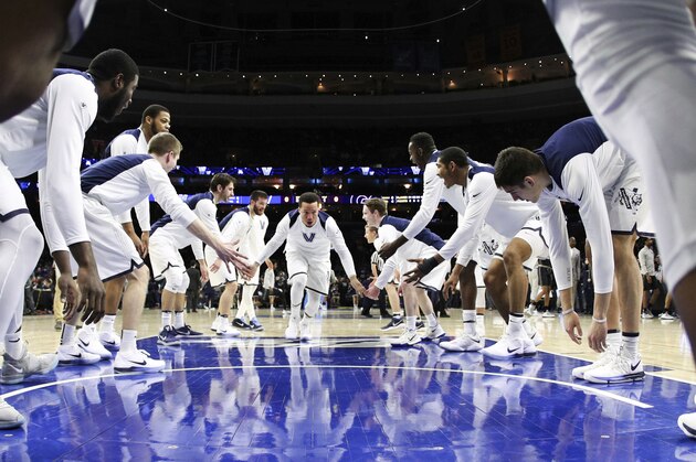 Villanova's Jalen Brunson, center, rallies his team before an NCAA college basketball game against Georgetown, Saturday, March 3, 2018, in Philadelphia. (AP Photo/Chris Szagola)