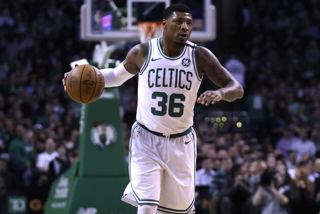 Boston Celtics guard Marcus Smart (36) dribbles during the first quarter of an NBA basketball game in Boston, Wednesday, Feb. 28, 2018. (AP Photo/Charles Krupa)