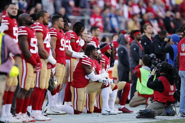 Some San Francisco 49ers players kneel during the playing of the national anthem before an NFL football game against the Tennessee Titans, Sunday, Dec. 17, 2017, in Santa Clara, Calif. (AP Photo/John Hefti)