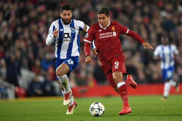 LIVERPOOL, ENGLAND - MARCH 06:  Roberto Firmino of Liverpool is challenged by Felipe of FC Porto during the UEFA Champions League Round of 16 Second Leg match between Liverpool and FC Porto at Anfield on March 6, 2018 in Liverpool, United Kingdom.  (Photo by Shaun Botterill/Getty Images)