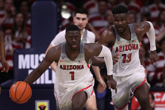 TUCSON, AZ - MARCH 03:  Rawle Alkins #1 of the Arizona Wildcats handles the ball alongside Deandre Ayton #13 during the second half of the college basketball game against the California Golden Bears at McKale Center on March 3, 2018 in Tucson, Arizona. The Wildcats defeated the Golden Bears 66-54 to win the PAC-12 Championship.  (Photo by Christian Petersen/Getty Images)
