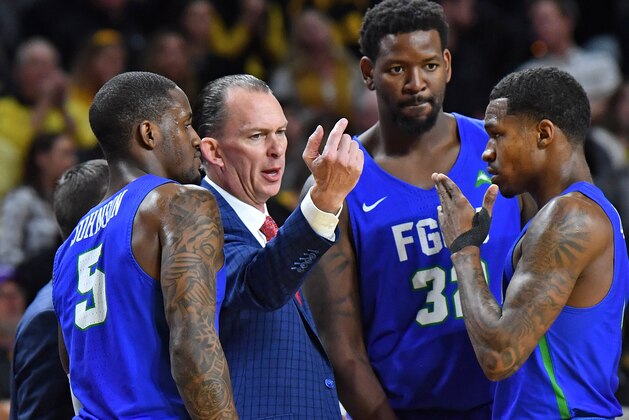WICHITA, KS - DECEMBER 22:  Head coach Joe Dooley (C)talks with his team during a time out in the second half against the Wichita State Shockers on December 22, 2017 at Charles Koch Arena in Wichita, Kansas.  (Photo by Peter G. Aiken/Getty Images)