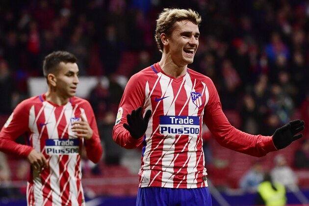 TOPSHOT - Atletico Madrid's French forward Antoine Griezmann (R) celebrates his fourth goal during the Spanish league football match Club Atletico de Madrid against Club Deportivo Leganes SAD at the Wanda Metropolitano stadium in Madrid on February 28, 2018. / AFP PHOTO / PIERRE-PHILIPPE MARCOU        (Photo credit should read PIERRE-PHILIPPE MARCOU/AFP/Getty Images)