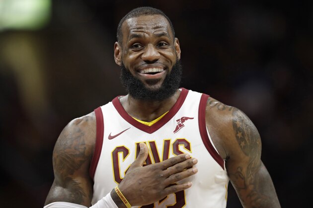Cleveland Cavaliers' LeBron James smiles in the first half of an NBA basketball game against the Detroit Pistons, Monday, March 5, 2018, in Cleveland. (AP Photo/Tony Dejak)