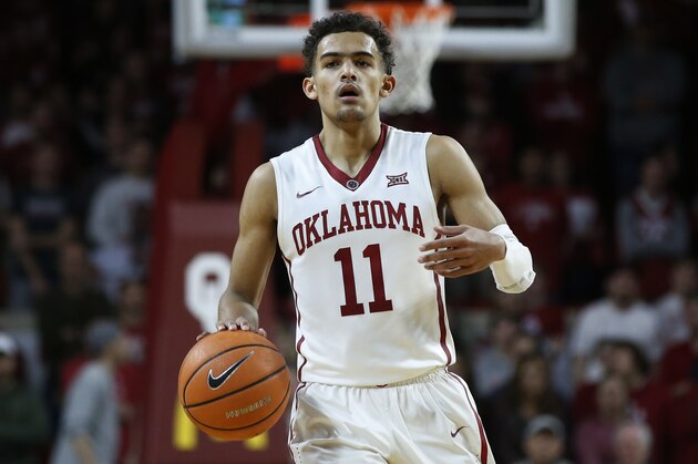 Oklahoma guard Trae Young (11) in the second half of an NCAA college basketball game against Texas in Norman, Okla., Saturday, Feb. 17, 2018. (AP Photo/Sue Ogrocki)