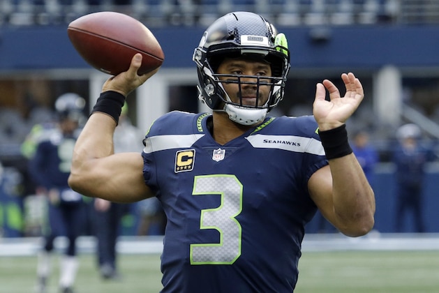 Seattle Seahawks quarterback Russell Wilson passes during warmups before an NFL football game against the Los Angeles Rams, Sunday, Dec. 17, 2017, in Seattle. (AP Photo/Elaine Thompson)