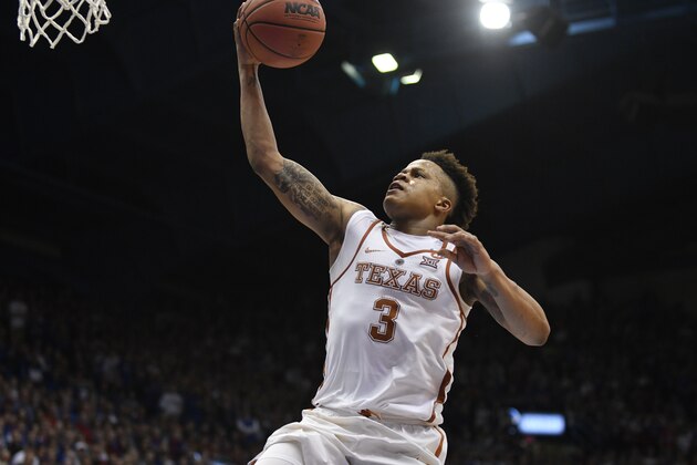 LAWRENCE, KS - FEBRUARY 26: Jacob Young #3 of the Texas Longhorns lays the ball up against the Kansas Jayhawks at Allen Fieldhouse on February 26,  2018 in Lawrence, Kansas. (Photo by Ed Zurga/Getty Images)