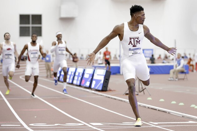 Texas A&M's Fred Kerley puts his arms out as he crosses the finish line to win the men's 400 meter dash during the NCAA indoor track and field championships Saturday, March 11, 2017, in College Station, Texas. (AP Photo/Michael Wyke)