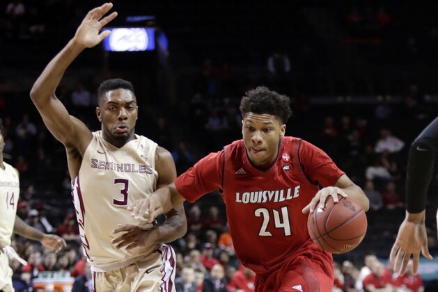 Florida State's Trent Forrest (3) defends as Louisville's Dwayne Sutton (24) drives during the first half of an NCAA college basketball game in the second round of the Atlantic Coast Conference tournament Wednesday, March 7, 2018, in New York. (AP Photo/Frank Franklin II)