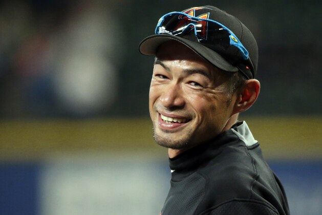 FILE - In this April 17, 2017, file photo, Miami Marlins' Ichiro Suzuki smiles to fans as he takes the field during batting practice before a baseball game against his former team, the Seattle Mariners, in Seattle. The Mariners finalized a one-year deal with 44-year-old Japanese star on Wednesday, March 7, 2018, after several outfielders got hurt. (AP Photo/Ted S. Warren)