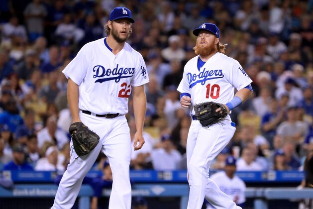 LOS ANGELES, CA - MAY 01:  Clayton Kershaw #22 and Justin Turner #10 of the Los Angeles Dodgers react to a Kershaw throwing error allowing Gorkys Hernandez #66 of the San Francisco Giants to reach base during the fourth inning at Dodger Stadium on May 1, 2017 in Los Angeles, California.  (Photo by Harry How/Getty Images)