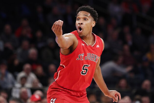 St. John's guard Justin Simon (5) reacts toward a referee during the first half of an NCAA college basketball game against Georgetown in the first round of the Big East conference tournament, Wednesday, March 7, 2018, in New York.