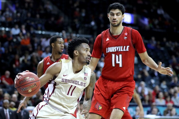 NEW YORK, NY - MARCH 07: Braian Angola #11 of the Florida State Seminoles works down the court against Anas Mahmoud #14 of the Louisville Cardinals in the second half during the second round of the ACC Men's Basketball Tournament at Barclays Center on March 7, 2018 in New York City.  (Photo by Abbie Parr/Getty Images)